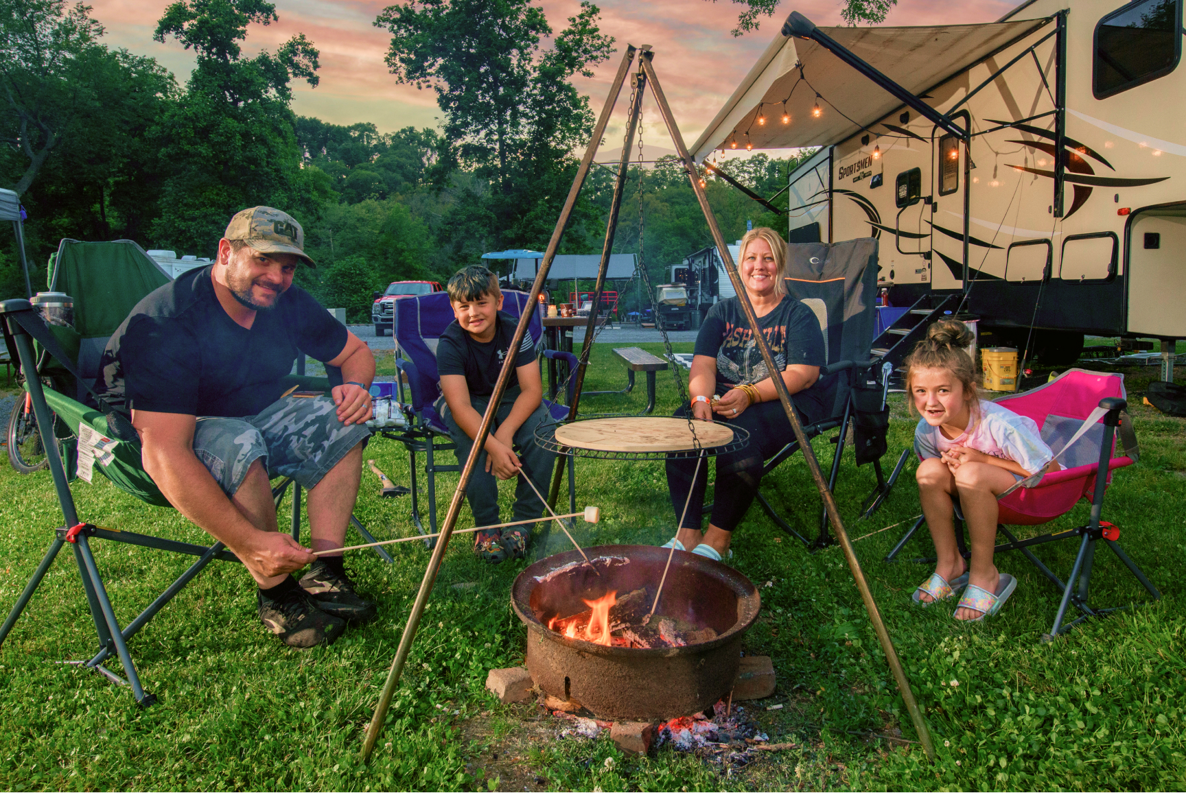 Family camping and campfire